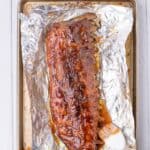 adding bbq sauce to baked pork ribs