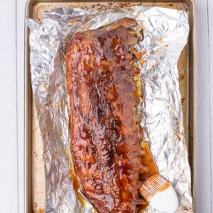 adding bbq sauce to baked pork ribs