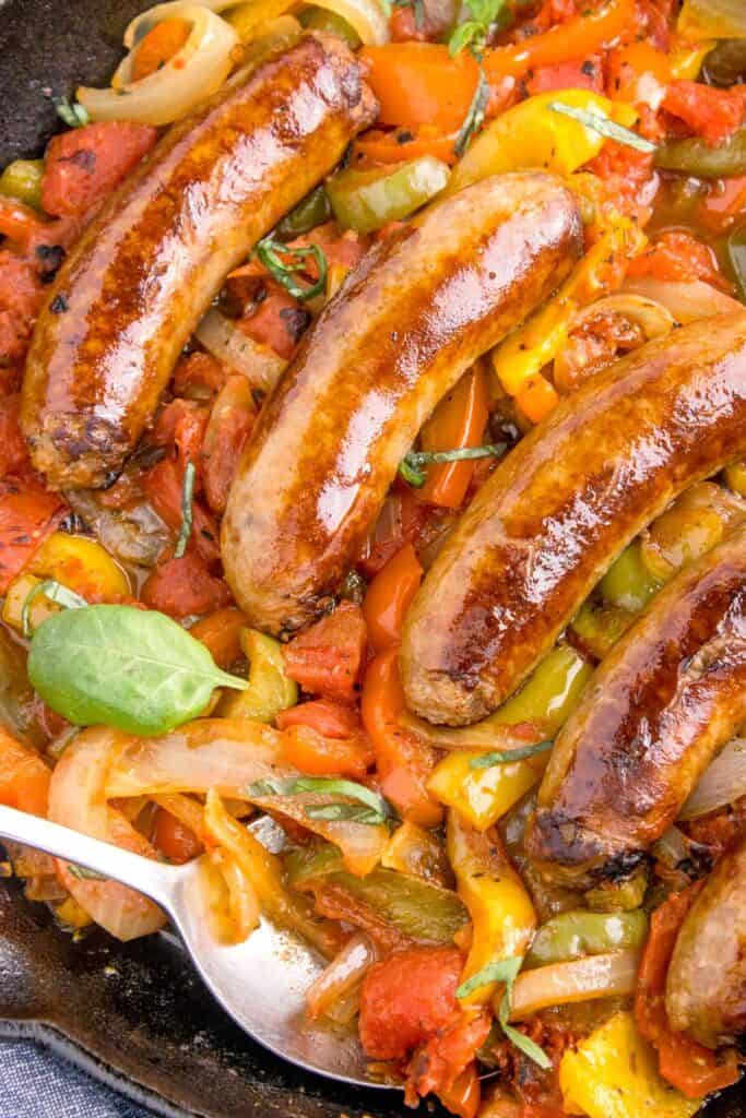 close up of sausage, pepper and onions