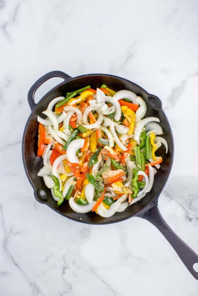 adding in italian spices to veggies