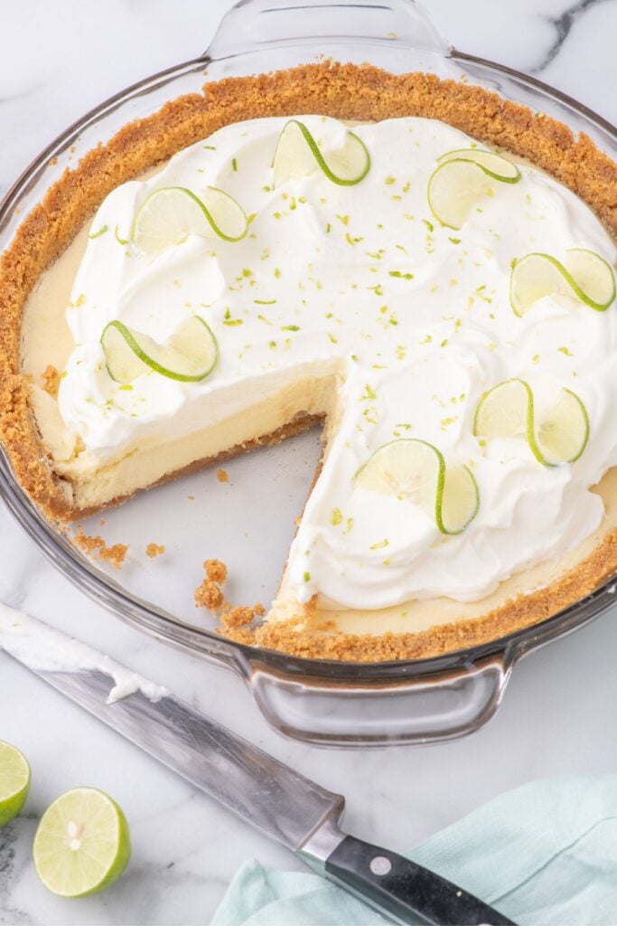 cutting a slice of lime pie