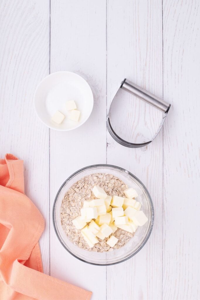 add cubed cold butter to oats and spices