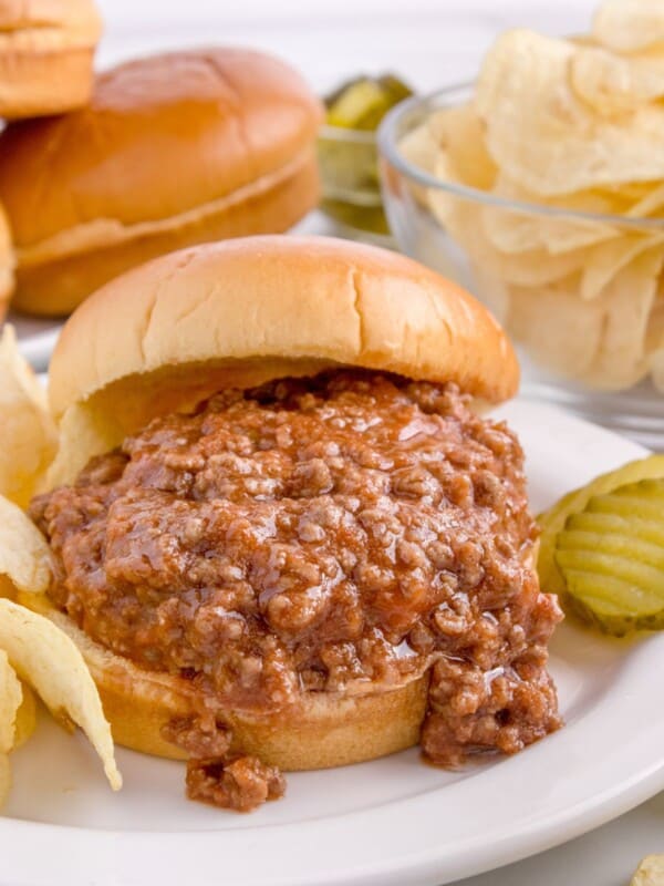 serving sloppy joe ground meat on a hamburger bun