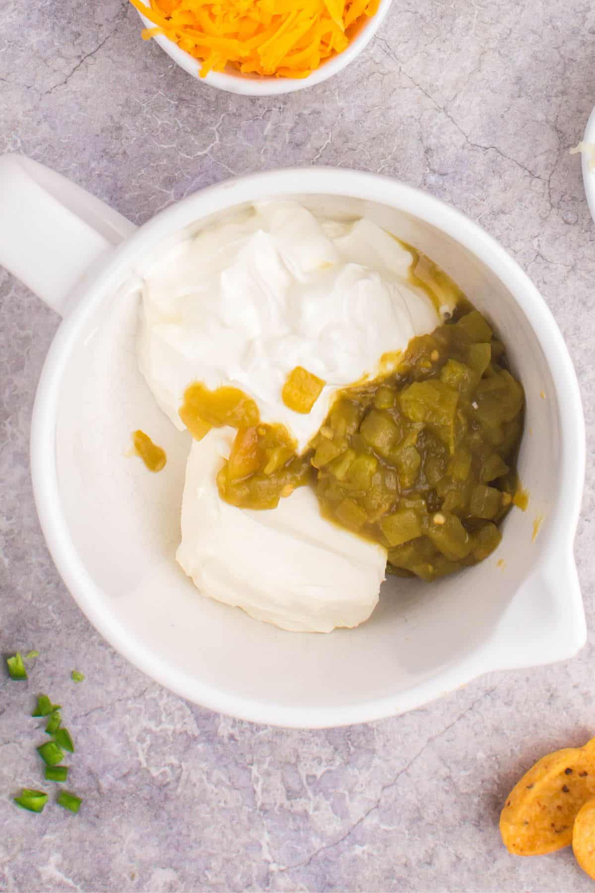 The green chilies, sour cream, and cream cheese added to mixing bowl.
