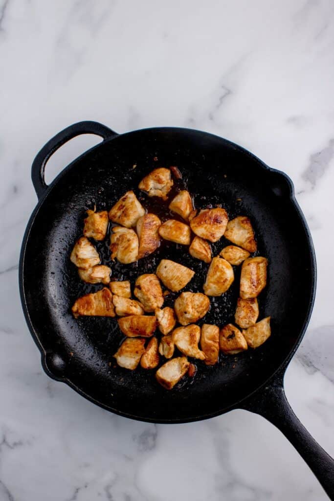Chicken cooked in cast iron pan.