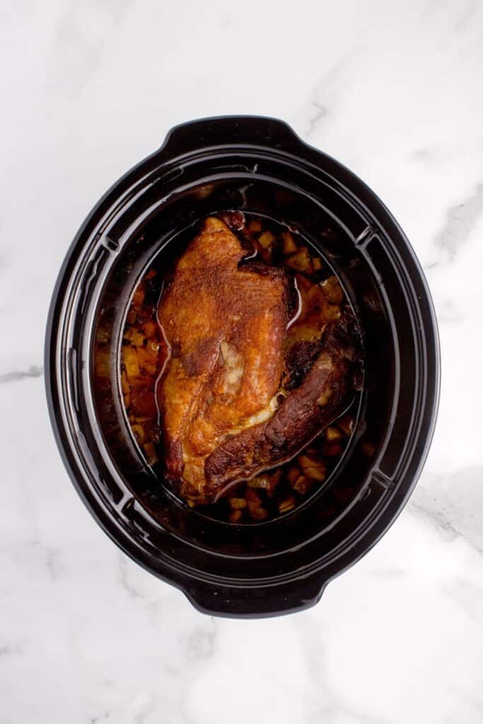 Pork shoulder cooked in a crock pot insert.