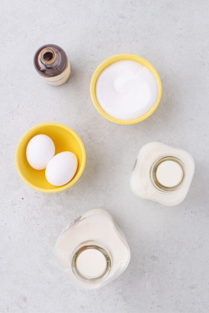 Ingredients for vanilla ice cream: eggs, granulated sugar, pure vanilla extract, whole milk, and heavy cream.