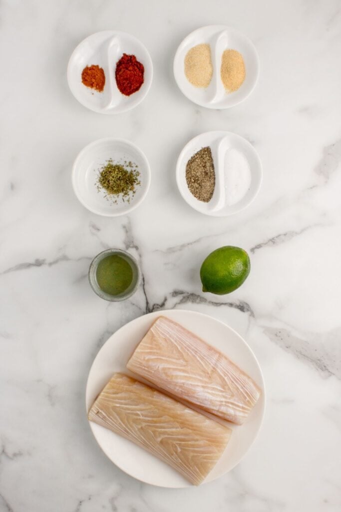 Ingredients for blackened mahi mahi: mahi mahi fillets, avocado oil, lime, onion powder, garlic powder, smoked paprika, Italian seasoning, salt, black pepper, and cayenne pepper.