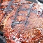 Close up view of London broil on the grill.