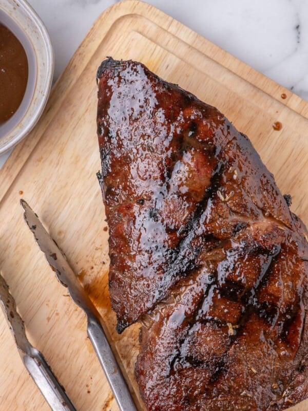 London broil resting on a cutting board.