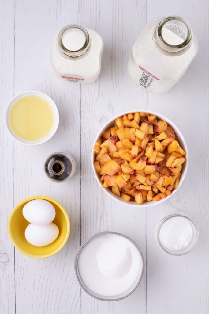 Ingredients for peach ice cream: peaches, sugar, lemon juice, eggs, vanilla, whole milk, heavy cream, and salt.