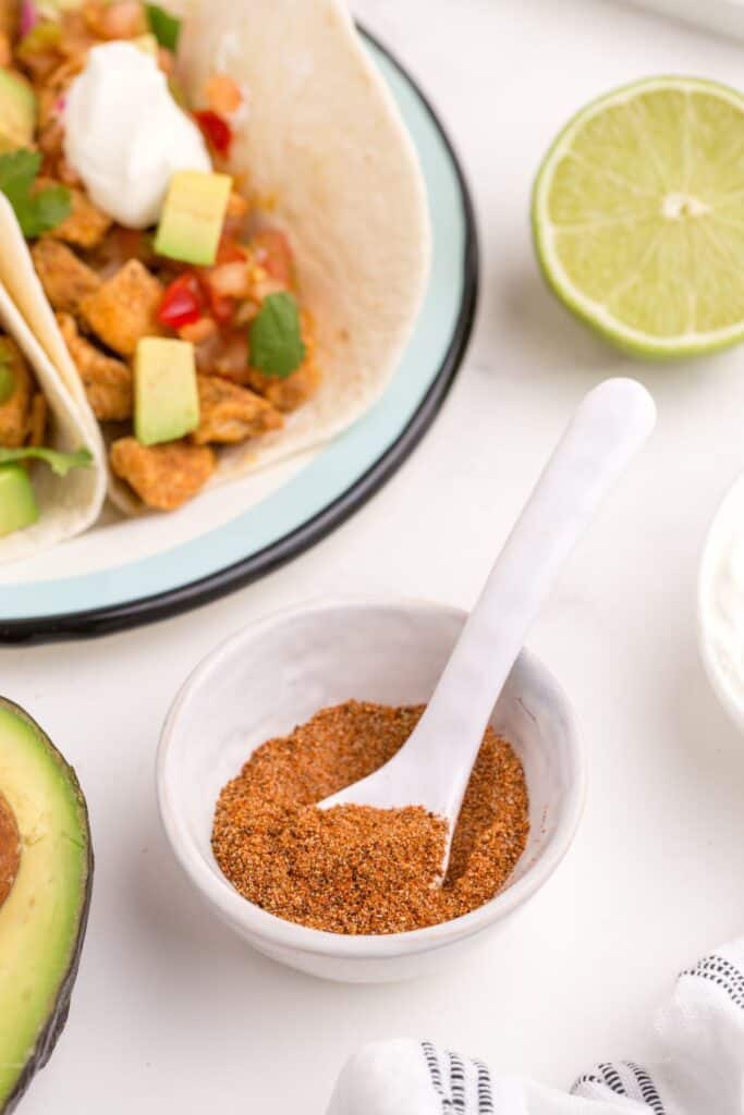A small bowl of homemade chicken taco seasoning.