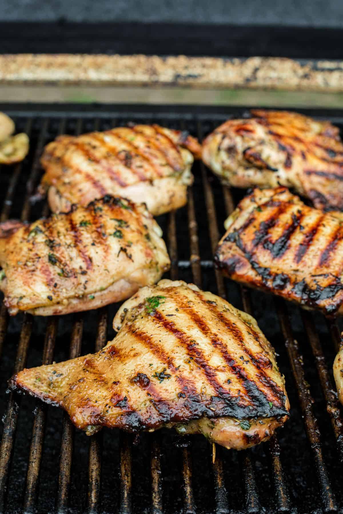 Chicken cooking on a grill.