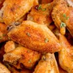 Pile of baked chicken wings.