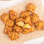 Corn nuggets piled up on a sheet of parchment paper.