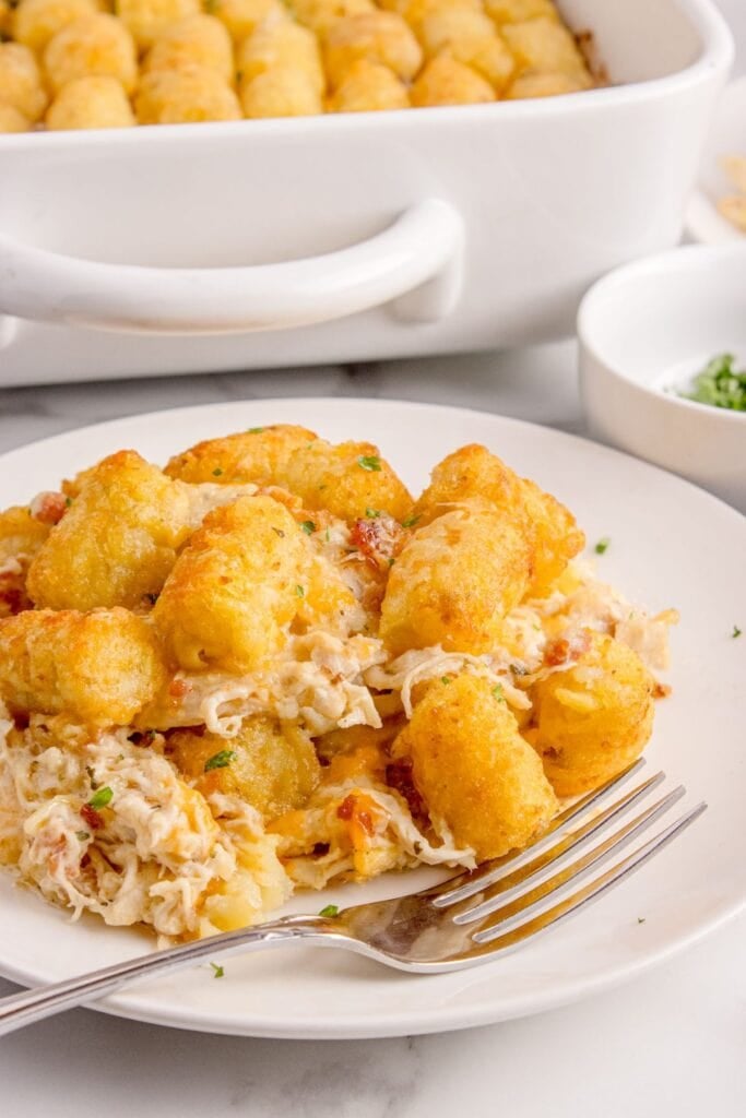 Chicken casserole served on a white dinner plate with a fork.