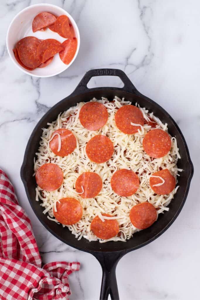Dip is finished with a layer of pepperoni.