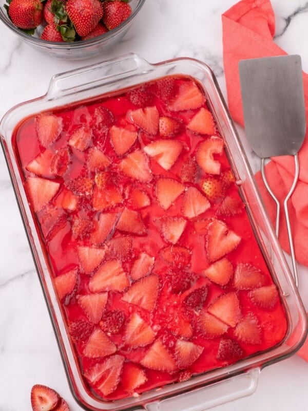 Chilled strawberry salad in a glass baking dish.