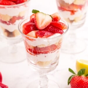 Completed strawberry parfait in three tall glasses.