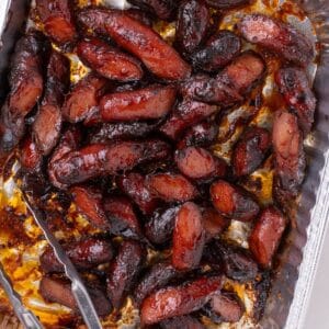 Hot dog burnt ends in a aluminum baking dish.