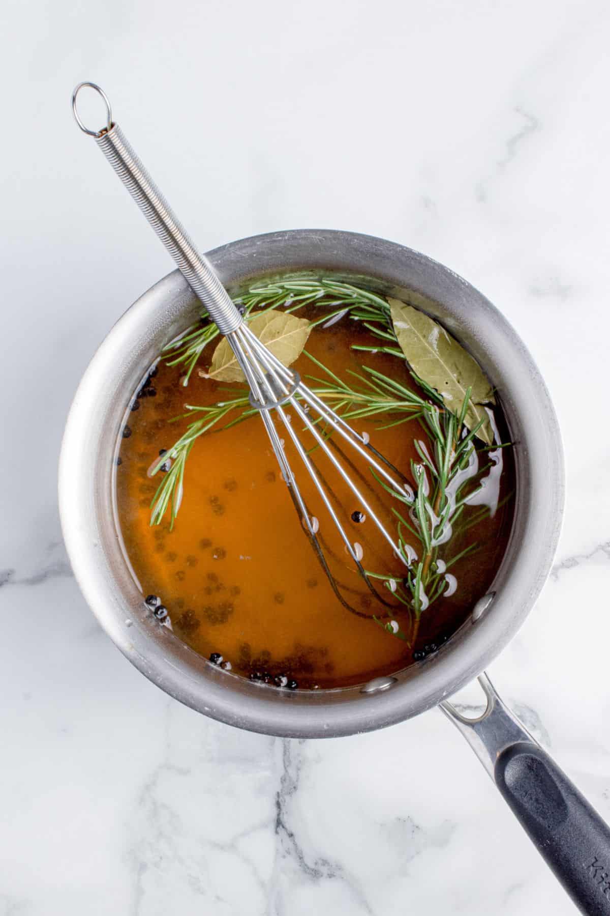 Brine ingredients combined and dissolved in a saucepan.