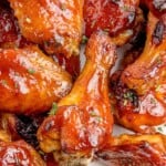 Close up of BBQ wings on a serving plate with blue cheese.