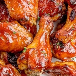 Close up of BBQ wings on a serving plate with blue cheese.