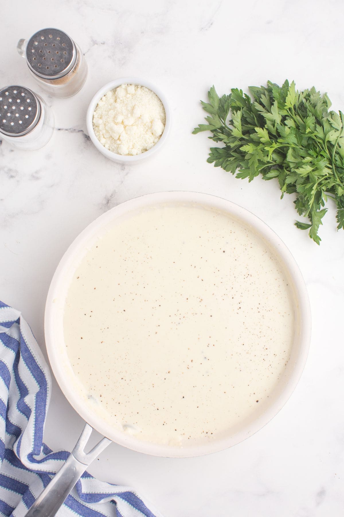 Alfredo sauce with cream cheese in a large skillet.