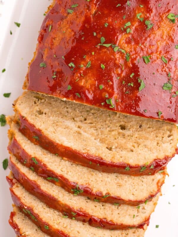 Closeup of the chicken meatloaf with half sliced.