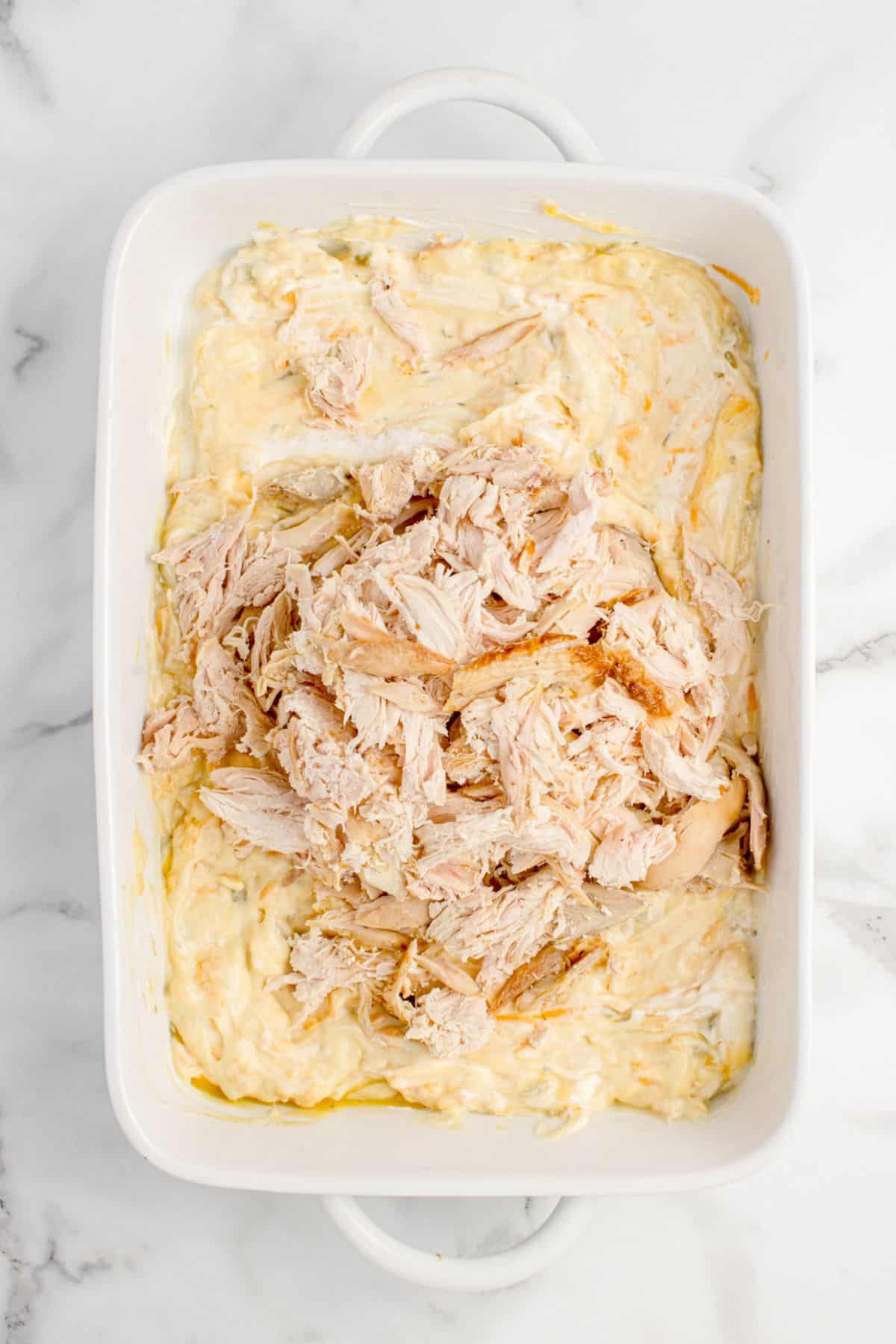 Rotisserie chicken is shredded and added to the sauce.