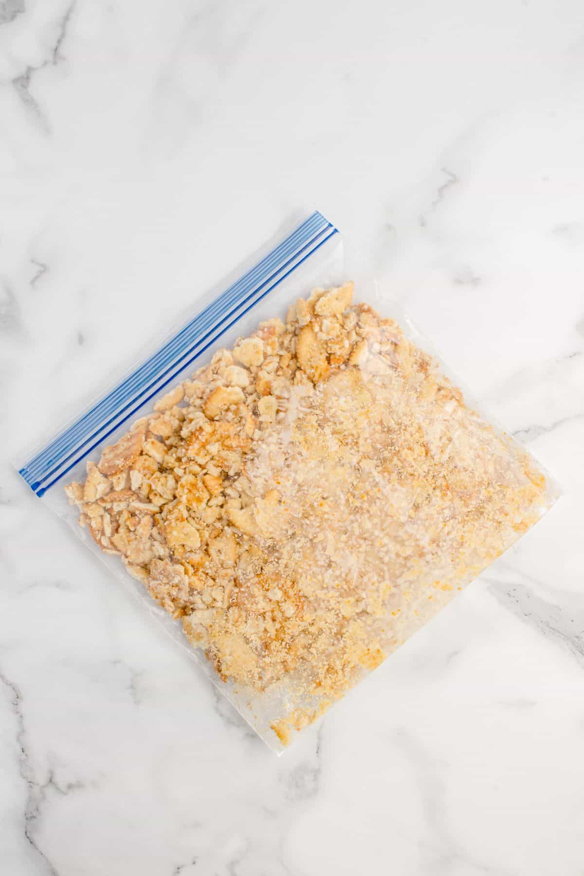 Ritz crackers crumbled in a bag.